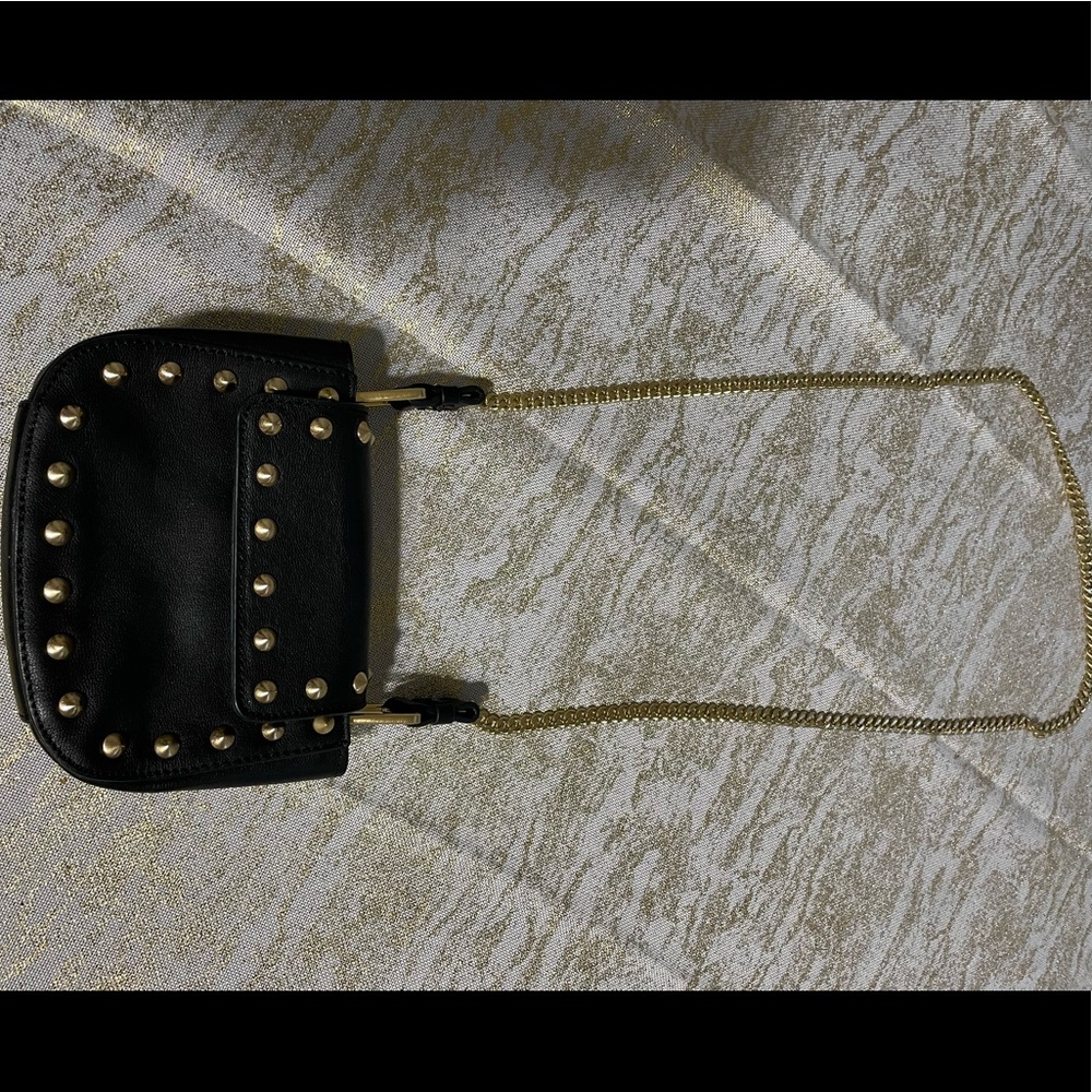 Brian Atwood. Small crossbody shoulder bag. Black with gold studs and strap.